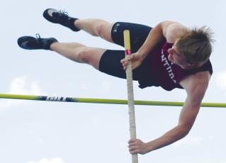 CENTURA’S CALVIN ZIMMERMAN cleared 13-00 to place second in the boys’ pole vault last Thursday. Zimmerman qualified for this week’s Class C state track meet in Omaha. Photo by Michael Happ