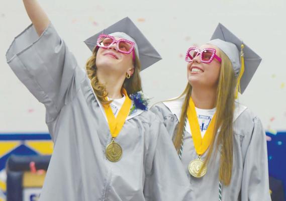 SNAPPING A CELEBRATION SELFIE on Sunday were Gracie Mudloff and Emma Elstermeier. Mudloff and Elstermeier were two of fifty-two graduates to receive diplomas from St. Paul High School this week. Photos by Michael Happ