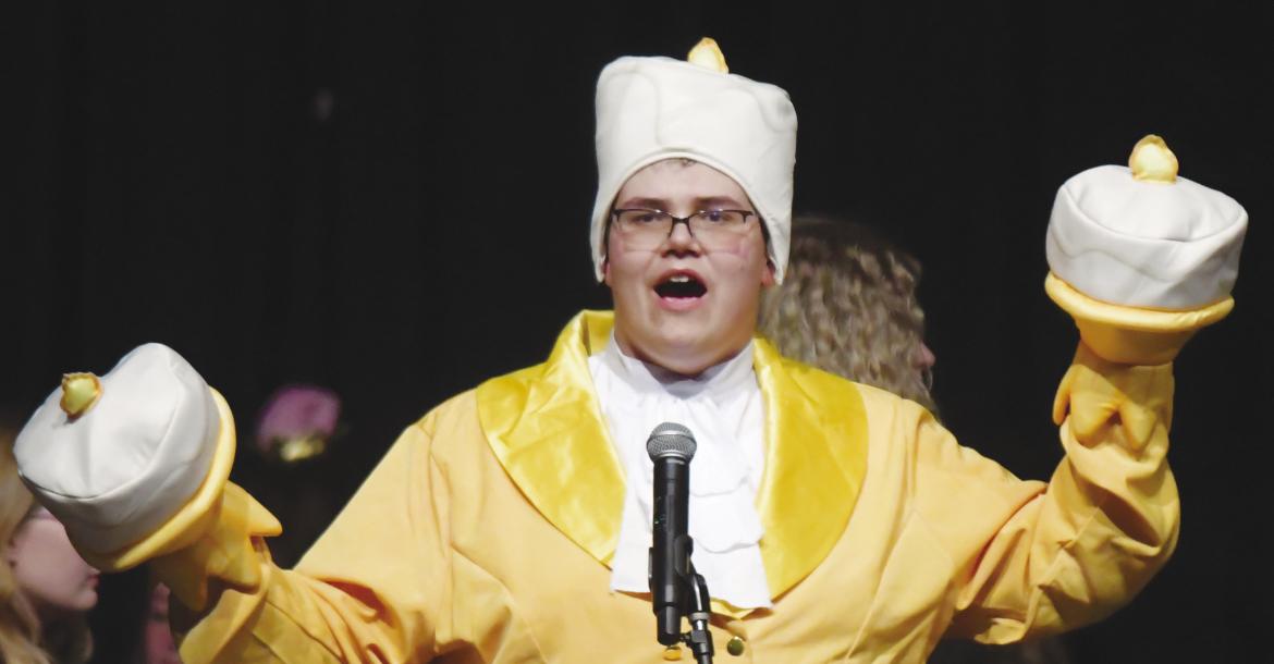 JOSEF KASLON was the Candlestick during a performance of Be Our Guest, which was the opening number of St. Paul High School’s variety show on Saturday night. Photos by Michael Happ