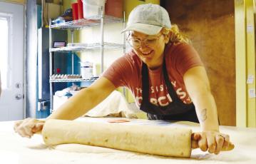 KELSIE WILSON, who owns The Danish Bakery alongside her husband, Justin, rolls out dough for fresh kolaches on a Friday morning at the longstanding Dannebrog establishment. Photos by Michael Rother