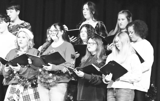 MEMBERS of the St. Paul High School Choir performed a trio of selections—including “How Like a Winter,” “Amid the Falling Snow,” and “Carol of the Bells” during last Thursday night’s Winter Music Concert at St. Paul Public Schools. The high school and junior high choirs, as well as both bands, performed during the event. Photo by Michael Happ