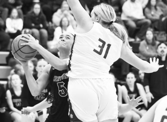 TAYA TAUKIUVEA goes up for a bucket during Friday night’s game between Centura and Central City. Taukiuvea had a game-best nineteen points in the contest. Photos by Jordan Coslor
