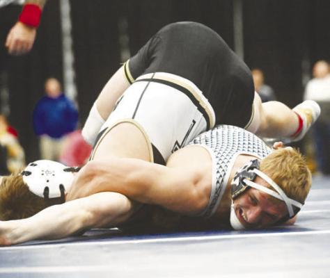 WILLIAM POKORNY needed just fifty-one seconds to pin Aquinas Catholic’s Landon Pohl during the opening dual of the NSAA Class D State Dual Wrestling Championships. Photo by Michael Happ