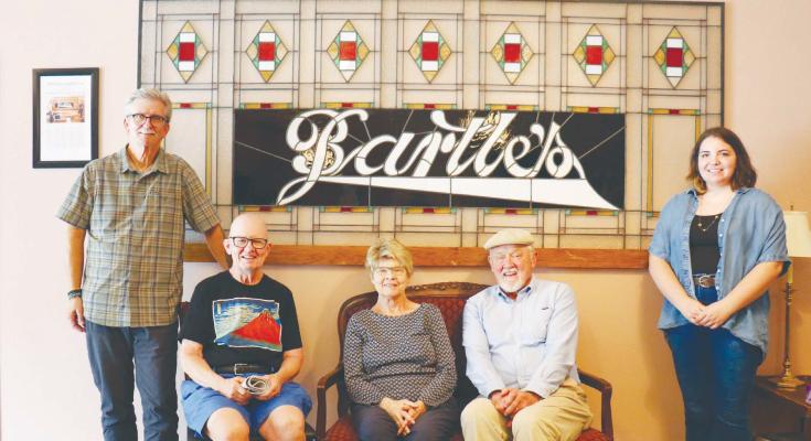 THE HISTORIC BARTLE’S SIGN at the Howard County Historical Society was the subject of a reunion and discussion at the Shubert-Nielsen Exhibit Hall last Tuesday. Pictured at the hall are Restorationist Ken Eldridge, the Bartle siblings Eli, Margaret, and Bob, and Restorationist Rebecca Robertson. Photo by Michael Rother