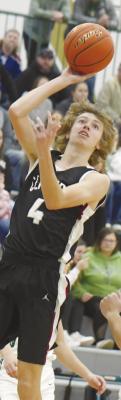 CENUTRA junior Barrett Fries puts up a layup in the first quarter of Friday night’s game. Photo by Michael Happ
