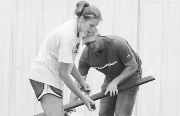 VOLUNTEERS were busy making improvements at the Howard County Fairgrounds on Monday night. The Howard County Fair is scheduled to get underway in earnest on Saturday. Photo by Michael Happ