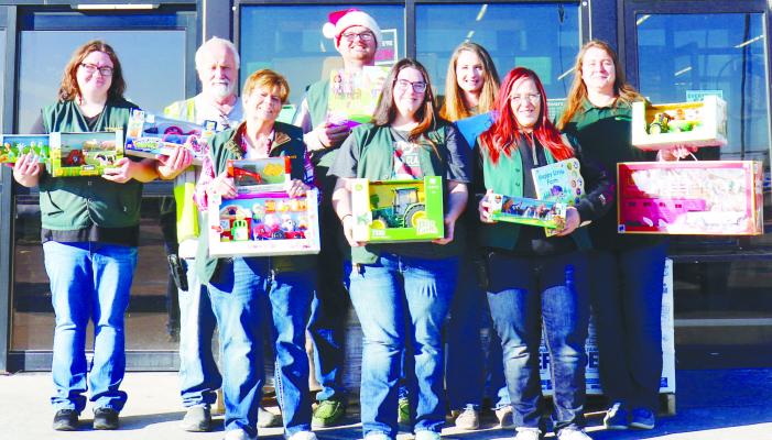 BOMGAARS employees pictured with toys this year include (back row): Adrianna Fitzsimmons, Elwin Beed, Daniel Ford, Andrea Boehle, Leanne Priest; (front row): Jackie Brownlee, Brianna Cassell, and Mandy Stone. Photo by Michael Rother