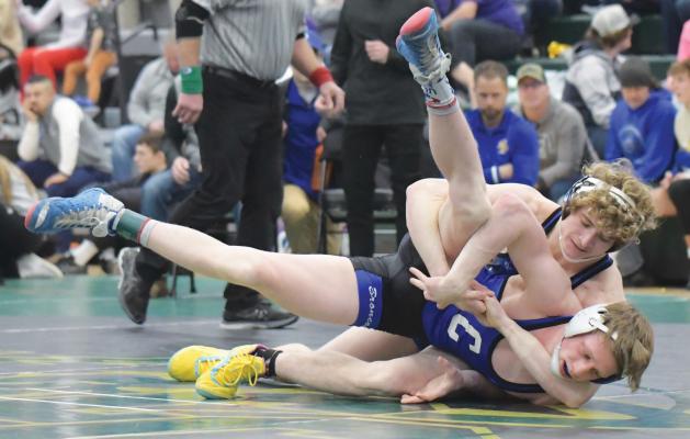 ST. PAUL’S OWEN SACK works to pin Centennial’s Jarrett Dodson on Saturday. The Wildcat would end up going all three periods against the Bronco, with Sack winning the semifinal match at 145-pounds 3-2. (Michael Happ)