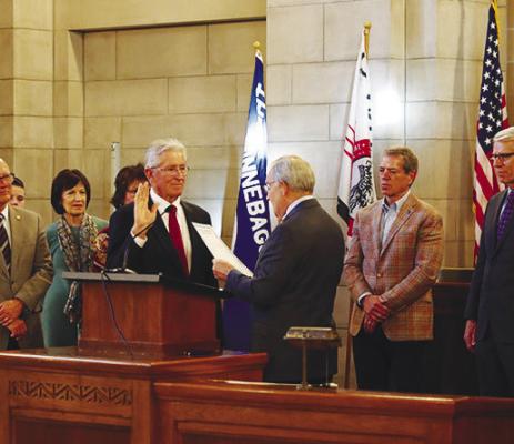 FRED MEYER of St. Paul takes the Oath of Office at the Nebraska State Capitol last Wednesday. Meyer was sworn in by Secretary of State Bob Evnen. Also pictured is Nebraska Governor Jim Pillen. Courtesy Photo