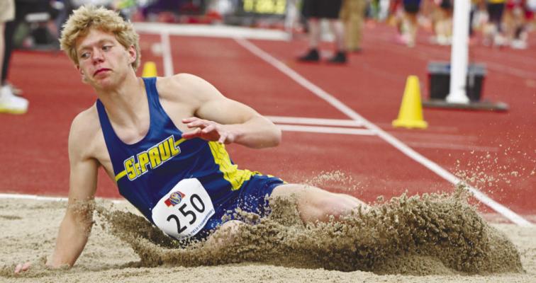 ST. PAUL’S Conner Douthit plows into the pit during the boys’ triple jump on Friday morning at the NSAA Class C State Track and Field Championships at Omaha’s Burke Stadium. Douthit placed second in the triple jump with a leap of 44-09.50. Photos by Michael Happ
