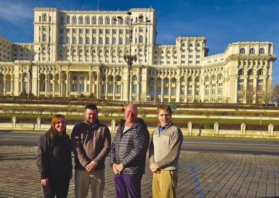 MICHELLE BOSE, left, and her fellow LEAD 42 classmates—Kelby Sudbeck, Brad Parliament, and Levi French—pose in front of Palace of Parliament in Bucharest, Romania during LEAD’s international seminar this January. Courtesy Photo