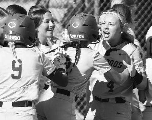 MEMBERS of the Centura softball team celebrate a home run by Lauren Suntych during the Diamonds’ game against Freeman last week. Photos by Jordan Coslor