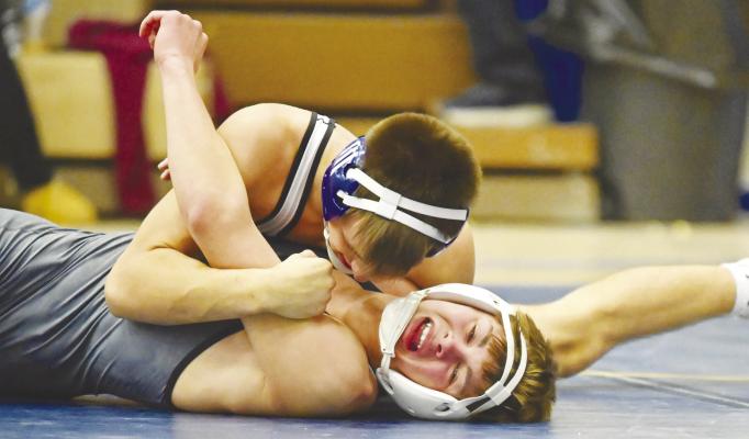 DERRICK RUZICKA needed just eighty-two seconds to pin Gavin Hanson of Crofton/Bloomfield during the Wildcats’ final dual of last Friday’s dual tournament at St. Paul High School. The Wildcats won the tournament title based on criteria. Photos by Michael Happ
