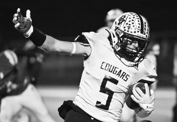 GRADY KELLEY fights for yards during the second half of last week’s game between Central Valley and Archangels Catholic. Kelly netted sixty-five yards on Friday and scored three rushing touchdowns. Photos by Michael Happ
