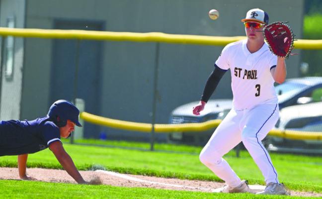 BRAXTON HEATER attempts to pick an opposing base runner off first base during a game against York late last month. St. Paul Post 119 has improved their record to 6-1 this season with three wins at Broken Bow over the weekend. Photos by Michael Happ