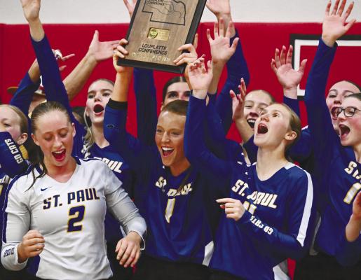 MEMBERS of the St. Paul High School volleyball team celebrate last week’s LouPlatte Conference volleyball championship, the program’s ninth in ten years. Photo by Michael Happ