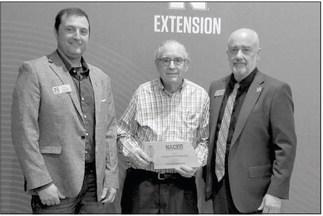 GARY RASMUSSEN was awarded the Friend of Extension Award during the Nebraska Association of County Extension Boards’ (NACEB) Legislative Day, which gives over 500 Extension board volunteers an opportunitty to meet, network, and engage with their senators. Pictured at the March 28th event are, left to right, Ryan Ridenour, Gary Rasmussen, and Charlie Stoltenow.(Courtesy Photo)