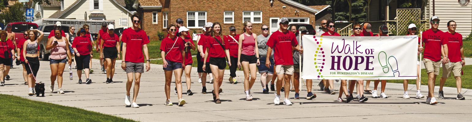 PARTICIPANTS in the 2025 Walk of Hope for Huntington’s Disease make their way down Howard Avenue on Saturday morning. This year, participants walked a mile around St. Paul. Photos by Michael Happ
