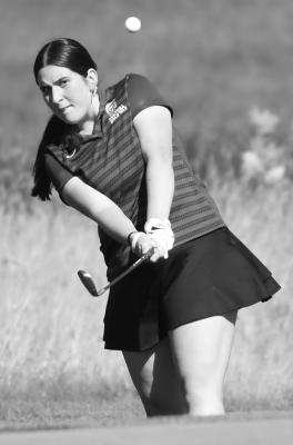 DOTTIE ROBERTSON chips on to the green at Centura Hills last week. Photos by Jordan Coslor
