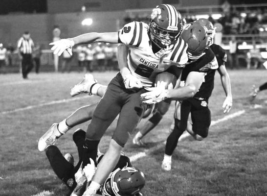 CENTURA’S FLETCHER FRIES fights for yardage after making a reception during the second quarter of last week’s game against St. Paul. Fries had one catch for eighteen yards in the contest. Photos by Michael Happ