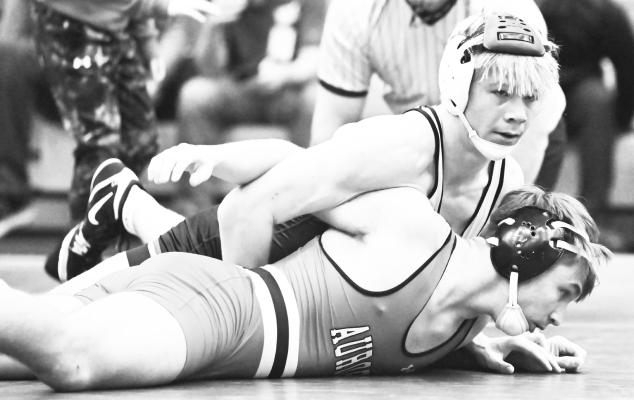 ST. PAUL’S DAWSON BECKER needed just over two minutes to pin Aurora’s Cooper Hudson during the Wildcats’ dual with the Huskies last Thursday night in St. Paul. Photos by Michael Happ