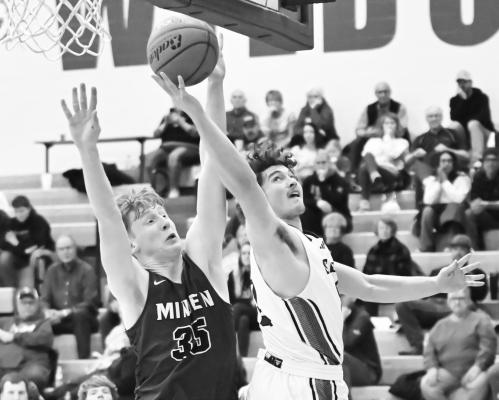 ST. PAUL senior Gage Sack stretches out for two of his fifteen points during the second half of St. Paul’s victory over Minden last Tuesday night. The Wildcats topped the Whippets 50-41. Photos by Michael Happ