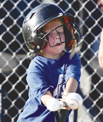 THE T-BALL DIAMOND was the place to be last Wednesday in St. Paul. Above, Kendal Volk makes contact during one of last week’s games. Photo by Michael Happ
