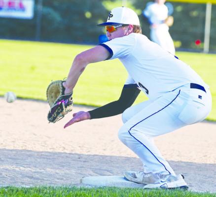 BRAXTON HEATER attempts to pick up an out at first base during a game earlier this summer. The Post 119 Seniors had won five straight games through the weekend. Photo by Michael Happ