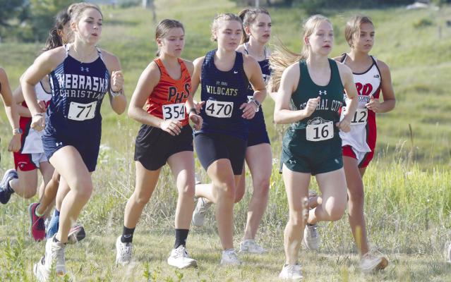 ST. PAUL’S NORAH PAULSEN battles in a pack of runners at the start of last Thursday’s race at the St. Paul Invite at Miletta Vista Winery. Photos by Michael Happ