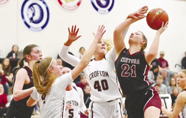 CENTURA’S KASSIDY HURT muscles her way past Crofton’s defense on her way to the rim during the first quarter of Friday night’s District C2-2 final at Crofton High School. Photo by Michael Happ