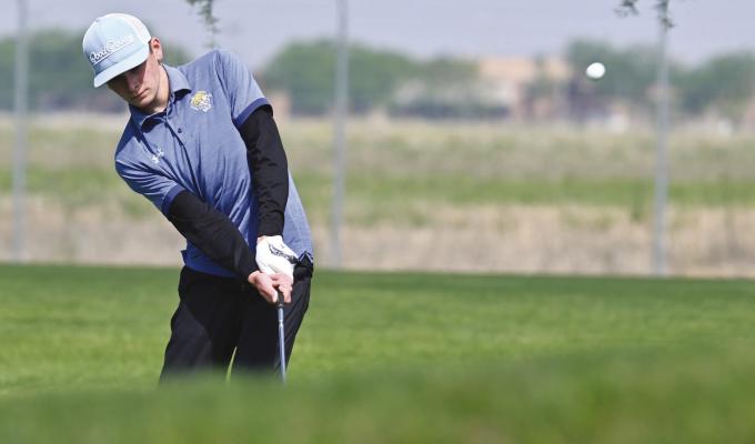 JACKSON WEGNER chips on to the first green of his final round at Jackrabbit Run Golf Course on Thursday morning. Wegner led the Wildcats at last week’s state golf meet, trying for twenty-second place. Photos by Michael Happ