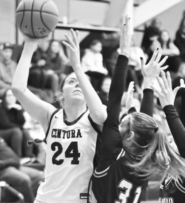 KENNEDY DAVIS drives into the lane for two points during the second half of Friday afternoon’s game against Fort Calhoun at the Blizzard Blowout Holiday Tournament. Photos by Michael Happ
