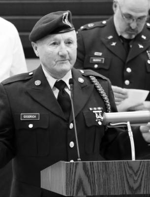 Photos by Michael Rother MIKE GOODRICH, above, was awarded with a Warrior Honorary Coin during the Central Valley Public Schools Veterans Day Ceremony on Friday. Below, Logyn Jarman and Darcy Buck speak about Dyllan Jarman.