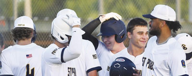 THE ST. PAUL SENIORS celebrate after one of their four home runs in last Thursday’s 13-0 win over Palmer-Wolbach-Greeley at Grover Cleveland Alexander Field in St. Paul. Photos by Michael Happ