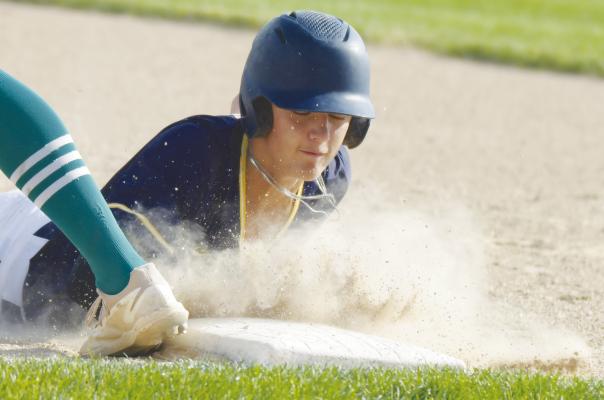JAYDN THOMSEN avoids getting picked off at first base during last Wednesday night’s game in St. Paul. The St. Paul Juniors ended up falling to Central City 5-3 in that contest. Photos by Michael Happ
