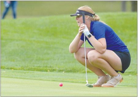 KAILEE SHREVE lines up her putt on the seventeenth green at Indianhead Golf Club in Grand Island on Friday afternoon. Photo by Jordan Coslor