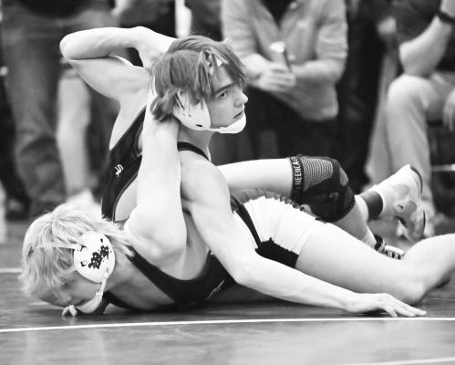 ST. PAUL’S Jaydn Thomsen bested Wood River’s Briggs Doane by tech fall on Friday at the Arcadia/Loup City Invite. Thomsen was one of three Wildcats who won individual titles in Sherman County. Photos by Michael Happ