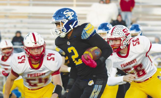 LEVI BADER skirts past a pair of Fairbury defenders during the opening drive of Friday night’s football game in St. Paul. The Wildcats ended up topping the Jeffs 46-6. Photos by Michael Happ
