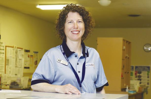 JESSICA ALLEN has been finding her footing over the last few months as the new postal support employee at the Wolbach post office. Allen said she has been enjoying the position, a job that she was hired for at the beginning of January. Photo by Michael Rother