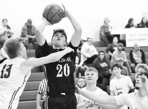 ST. PAUL’S BEAU PARO battles past Wood River’s defense during the consolation game of the LouPlatte Conference Tournament last week. Paro finished the game with fourteen points. Photo by Jordan Coslor