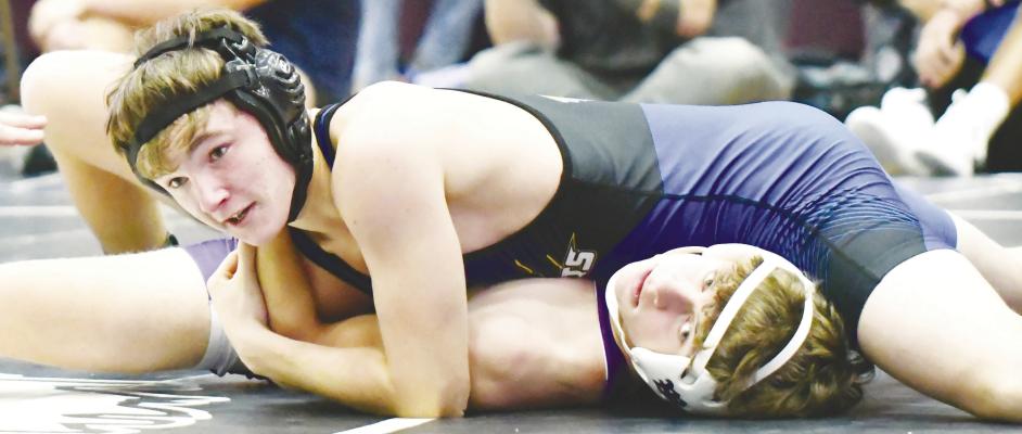 ADEN MITCHELL pins Wood River’s Tyler Gottlob during the consolation bracket at last week’s Wood River Invite. Mitchell picked up his first win of the year opposite the Eagle at last week’s meet. Photo by Jordan Coslor