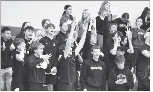 STUDENTS at Centura High School celebrate following a three-point basket by the Centura girls basketball team last Saturday night in the championship game of the LouPlatte Conference basketball tournament. Central City beat the Centurions in the finals of the tournament 33-32. Photo by Michael Happ