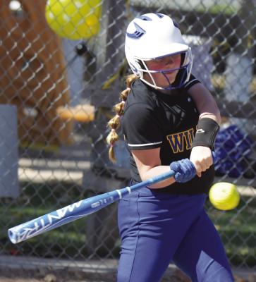 AUDRA DUGAN made contact during last week’s district final matchup between St. Paul and Northeast Nebraska. (Michael Happ)