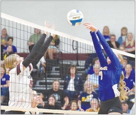 ST. PAUL’S NATALIE POSS tips the ball over the net during the first set of last Tuesday night’s match between the Wildcats and the Centurions. Photos by Michael Happ