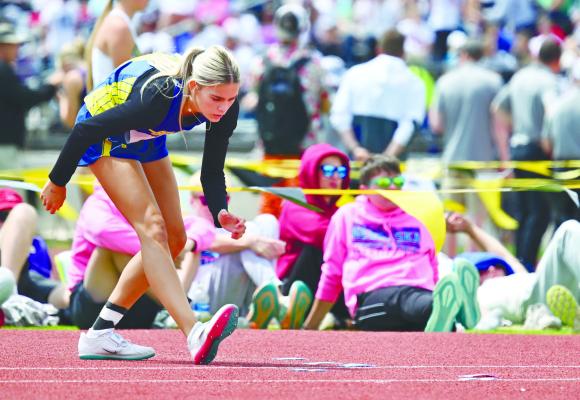 PIEPYR KLINGINSMITH begins her approach during the Class C girls’ high jump at last week’s NSAA Class C State Track and Field Championships in Omaha.