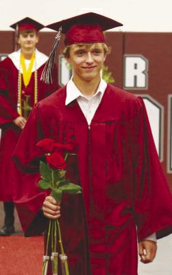 ISAAC LANDERS was all smiles as he made his way into the gymnasium prior to Saturday’s graduation ceremony at Centura High School. Landers was one of thirty members of the Class of 2025 to receive diplomas last week. Photo by Michael Rother