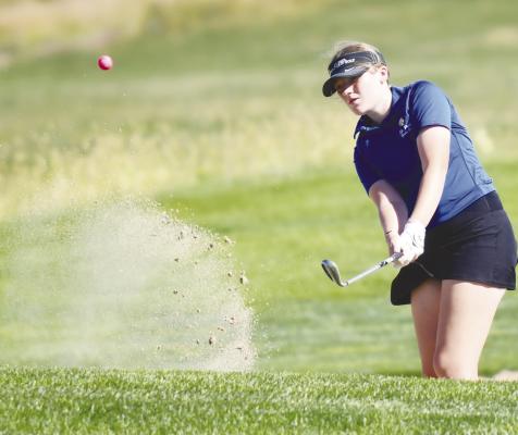ST. PAUL HIGH SCHOOL’S HADLEY QUINN chips on to the green from the sand during last week’s LouPlatte Conference Golf Tournament at Centura Hills Golf Course near Cairo. Photo by Jordan Coslor