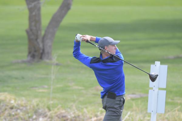 ST. PAUL’S Sam Wells sinks a putt on the eighth green during Monday’s St. Paul Invite. Wells finished the eighth hole of his round five strokes under par. (Michael Happ)