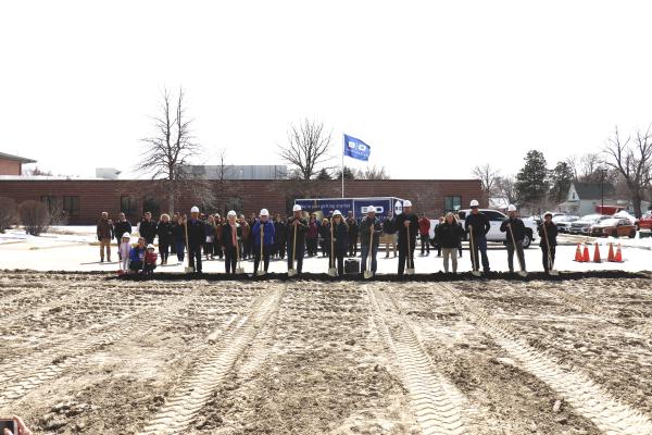 HELPING BREAK GROUND on Howard County Medical Center’s new wellness center are Kristin, Emery, and Layla Trenhaile, Mike Nelson, Harriet Steenson, Jan Thede, Dan Nielsen, Carol Schroeder, Dave Brehm, HCMC CEO Arlan Johnson, St. Paul City Councilmember Katie Kowalski, St. Paul Mayor Joel Bergman, Jeremy Taylor, and Lori Maddox. (Michael Rother)