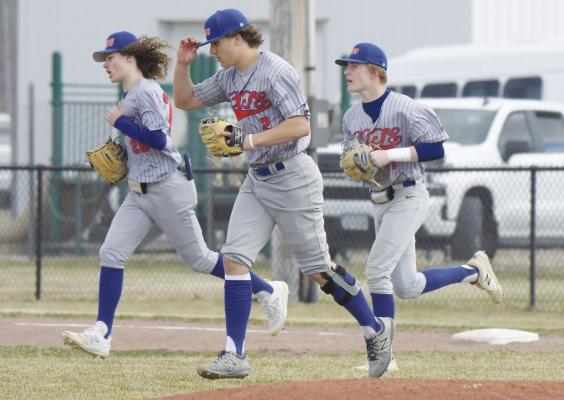 ST. PAUL/PALMER’S Zandyn Weller, Ashton Meinecke, and Gatlin Reimers take the field during a recent game. With Monday’s victory over Thurston-Cuming County, the Cats improved to 3-4 on the year. (Michael Happ)